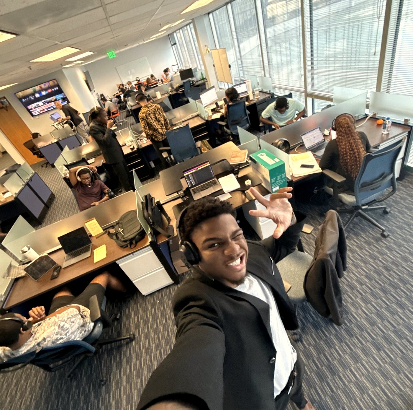 Eterna agents on headsets taking calls on the floor